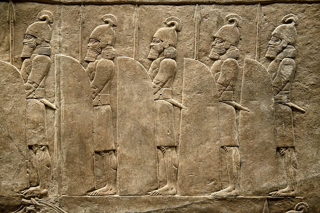 Assyrian relief sculpture panel of soldiers lining the road from the King Ashurnasirpal lion hunt. From Nineveh North Palace, Iraq, 668-627 B.C. British Museum Assyrian Archaeological exhibit no ME 120859